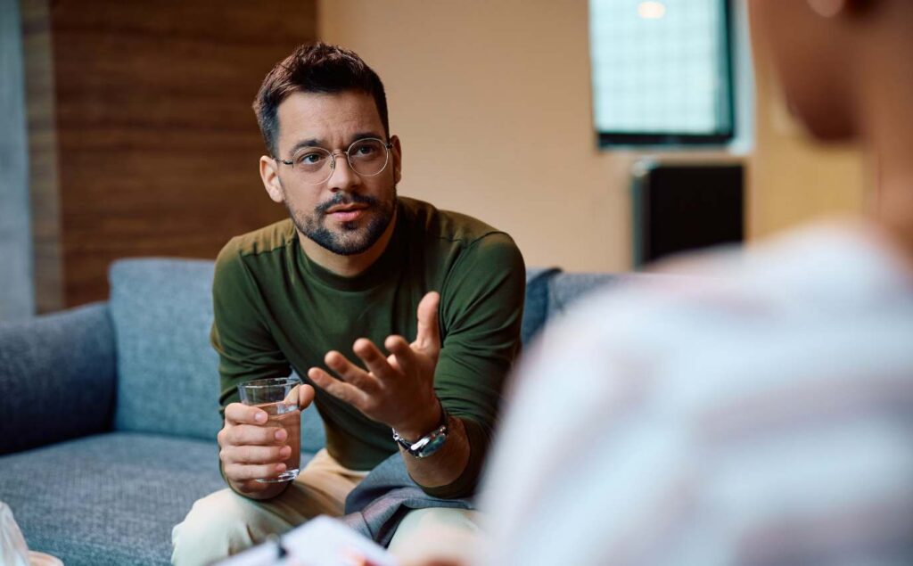 Individual therapy session with a therapist and client talking together.