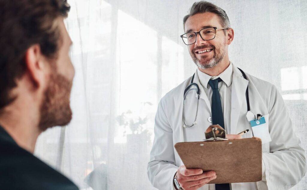 Doctor guiding a client through prescription drug addiction treatment.