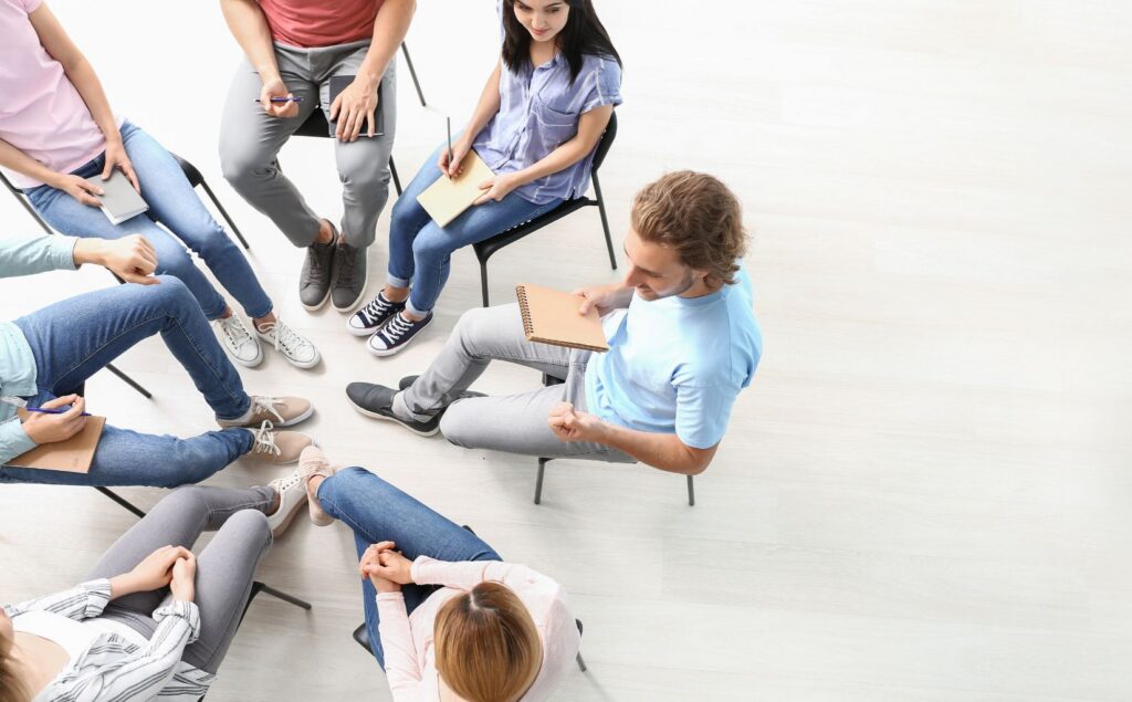 Group of clients participating in expressive arts therapy for addiction recovery in San Diego, CA.