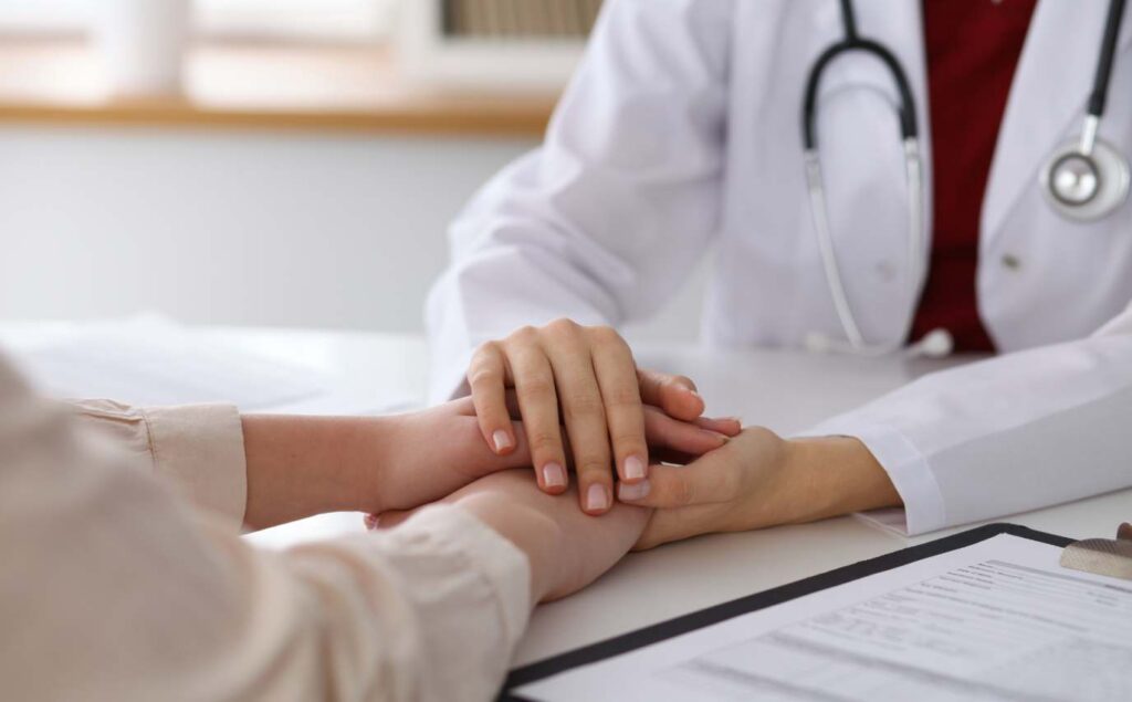 Client meeting with a doctor during medication-assisted treatment.