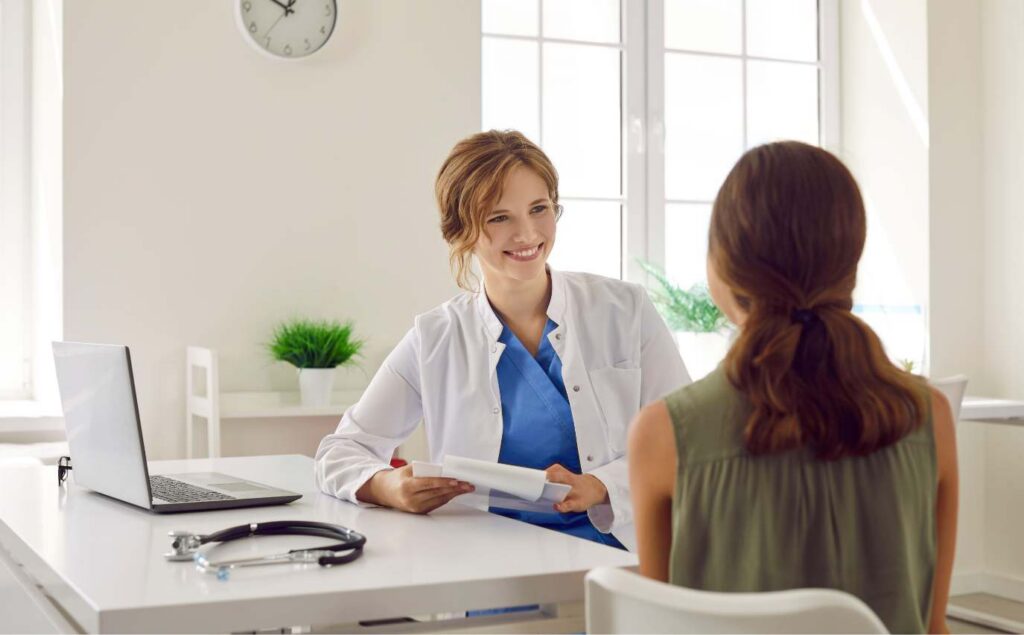 Doctor assisting a client through medication-assisted treatment.
