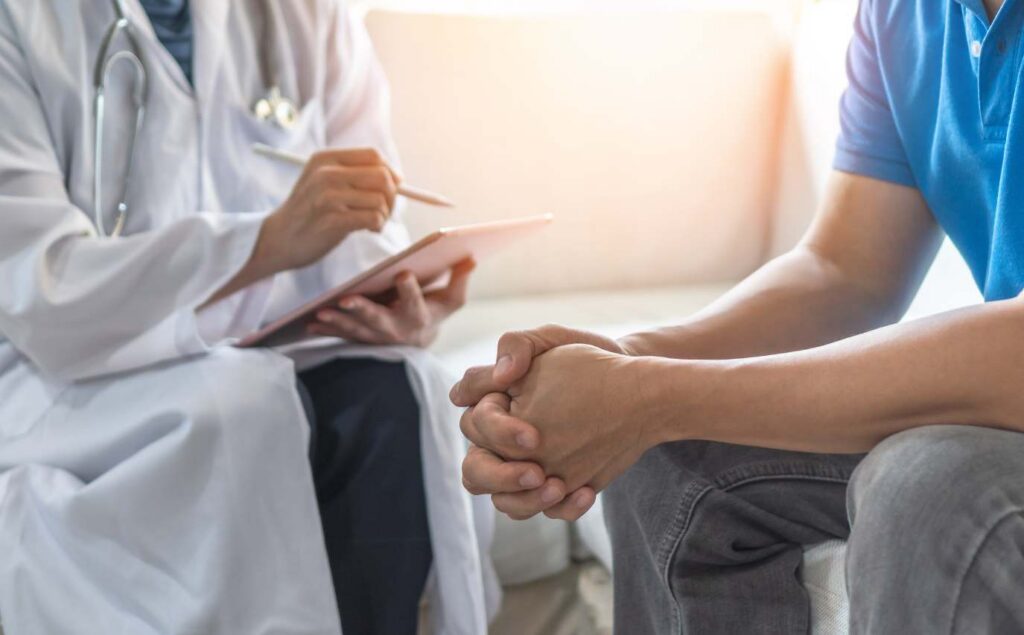 Man getting help during recovery at a San Diego detox center.