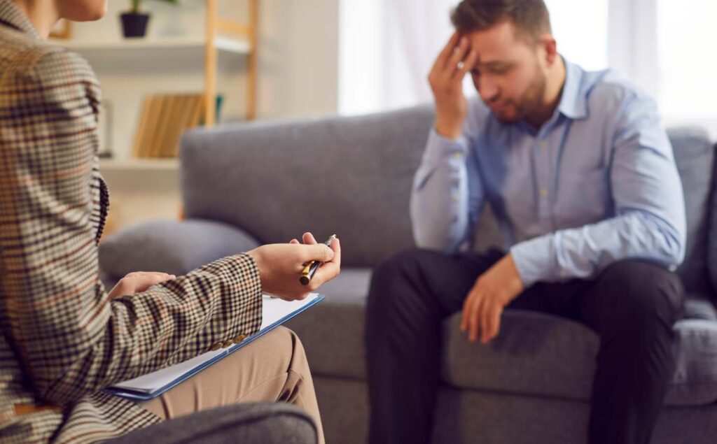 Psychiatrist speaking with a client during depression treatment in San Diego.