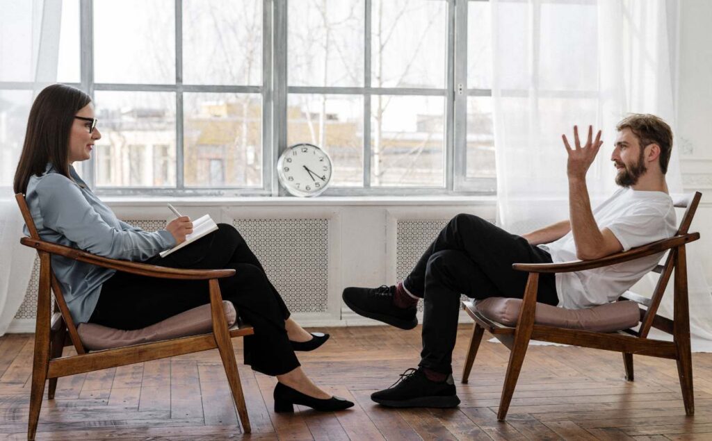 Psychiatrist supporting a client through depression treatment in San Diego, California.