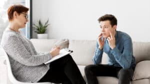 Psychologist speaking with a patient during addiction treatment at La Mesa rehab with Assure Recovery Center.