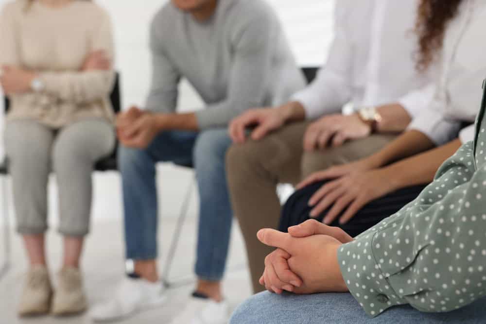 People participating in group therapy to address PTSD symptoms in first responders.